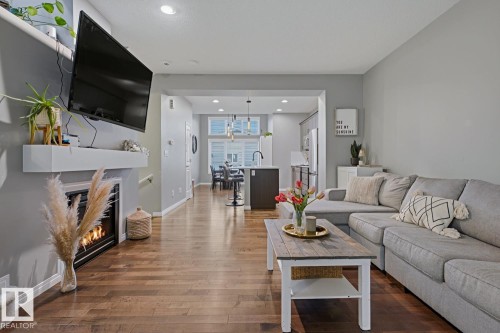 2015 74 Street Sw, Edmonton, AB - Indoor Photo Showing Living Room With Fireplace