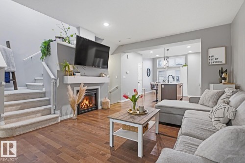2015 74 Street Sw, Edmonton, AB - Indoor Photo Showing Living Room With Fireplace