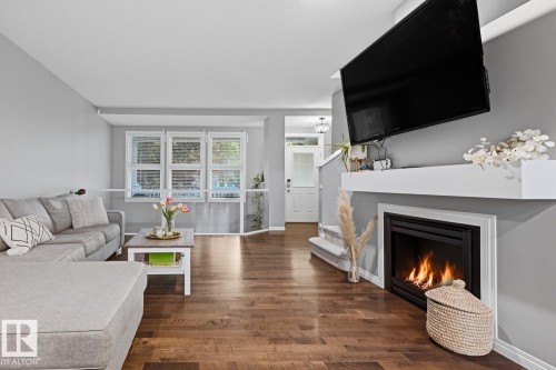 2015 74 Street Sw, Edmonton, AB - Indoor Photo Showing Living Room With Fireplace