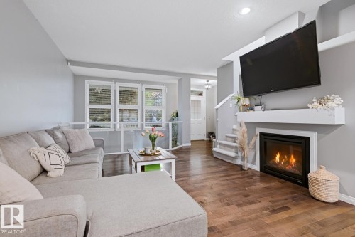 2015 74 Street Sw, Edmonton, AB - Indoor Photo Showing Living Room With Fireplace