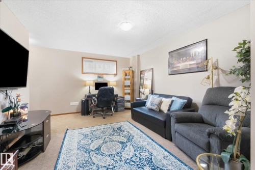 #27 290 Spruce Ridge Rd, Spruce Grove, AB - Indoor Photo Showing Living Room