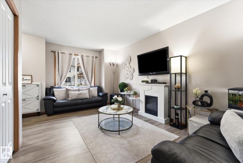 #27 290 Spruce Ridge Rd, Spruce Grove, AB - Indoor Photo Showing Living Room With Fireplace