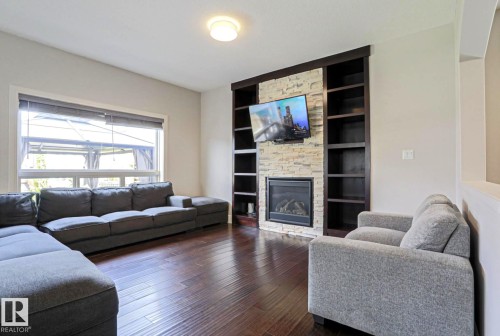 4642 Charles Way Sw, Edmonton, AB - Indoor Photo Showing Living Room With Fireplace