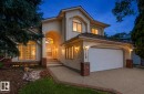 Stucco exterior featuring an arched entryway and an arched garage door - 140 Healy Road Nw, Edmonton, AB  - Outdoor 