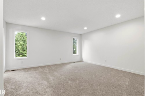 Spacious room featuring neutral carpet flooring and white walls - 140 Healy Road Nw, Edmonton, AB - Indoor Photo Showing Other Room