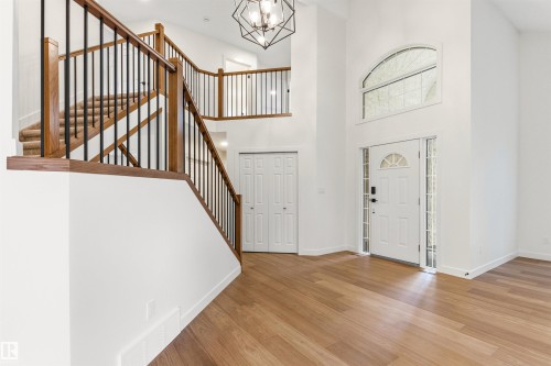 Entryway featuring a vaulted ceiling and wood-finish flooring - 140 Healy Road Nw, Edmonton, AB - Indoor Photo Showing Other Room