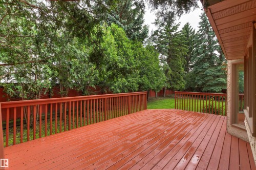 Spacious outdoor deck with reddish-brown wood planks and matching railing - 140 Healy Road Nw, Edmonton, AB - Outdoor With Deck Patio Veranda With Exterior