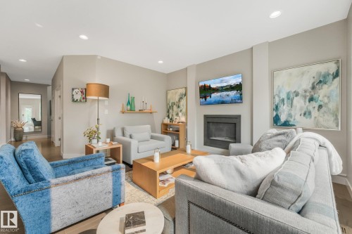 2722 Kirkland Way Sw, Edmonton, AB - Indoor Photo Showing Living Room With Fireplace
