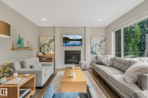 2722 Kirkland Way Sw, Edmonton, AB - Indoor Photo Showing Living Room With Fireplace
