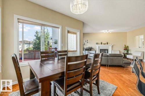 306 Hilliard Close Nw, Edmonton, AB - Indoor Photo Showing Dining Room With Fireplace