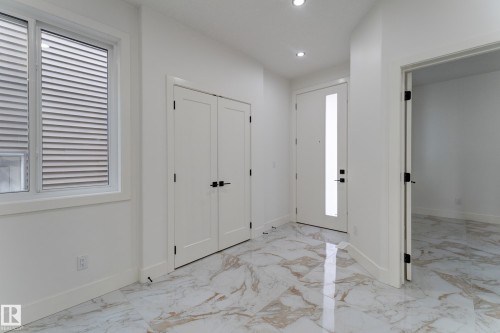 Entryway featuring polished marble-look tile flooring - 4723 17 Avenue Sw, Edmonton, AB - Indoor Photo Showing Other Room