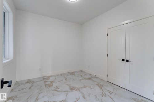 Interior room featuring white walls, white baseboards, and a single window with white trim - 4723 17 Avenue Sw, Edmonton, AB - Indoor Photo Showing Other Room
