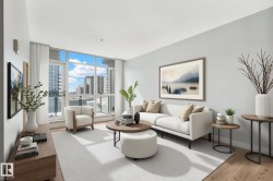 Living area featuring expansive floor-to-ceiling windows, wood-finish flooring, light gray wall finishes, and a large light-toned area rug - 