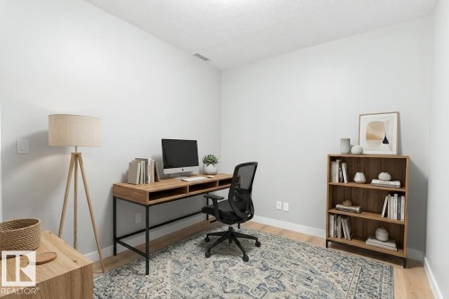 Light-toned walls with wood-finish flooring - #910 10238 103 St Nw, Edmonton, AB - Indoor Photo Showing Office