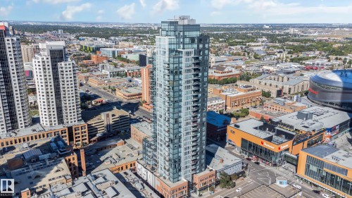Modern high-rise residential building featuring extensive glass curtain walls and numerous private balconies - #910 10238 103 St Nw, Edmonton, AB - Outdoor With View