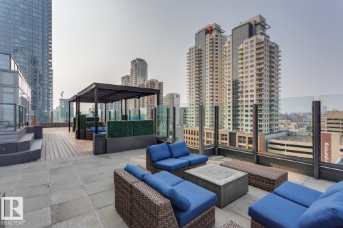 Rooftop patio featuring expansive paver and wood-finish decking - #910 10238 103 St Nw, Edmonton, AB - Outdoor With Deck Patio Veranda