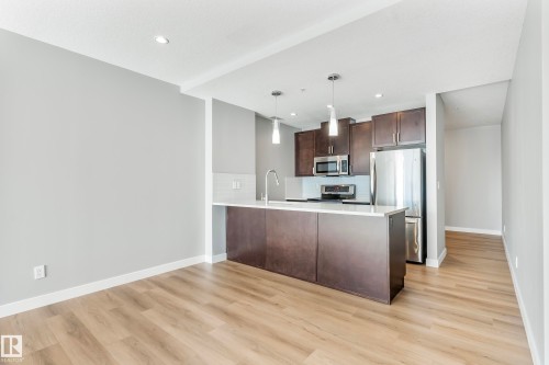 #910 10238 103 St Nw, Edmonton, AB - Indoor Photo Showing Kitchen With Stainless Steel Kitchen