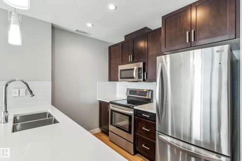#910 10238 103 St Nw, Edmonton, AB - Indoor Photo Showing Kitchen With Stainless Steel Kitchen With Double Sink