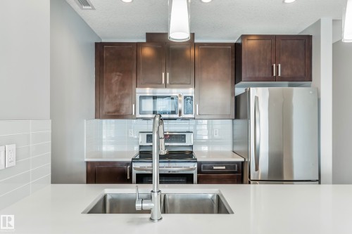 #910 10238 103 St Nw, Edmonton, AB - Indoor Photo Showing Kitchen With Stainless Steel Kitchen With Upgraded Kitchen