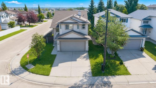 Two-story residential structure featuring a gray facade and a two-car garage - 3799 21 Street Nw, Edmonton, AB - Outdoor With Facade