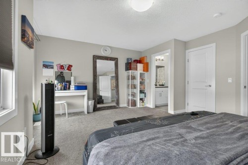 Spacious room featuring neutral carpeting and light gray wall paint - 848 Ebbers Crescent Nw, Edmonton, AB - Indoor Photo Showing Bedroom