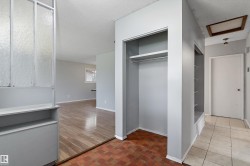 Entryway featuring a built-in shelving unit, coat closet - 