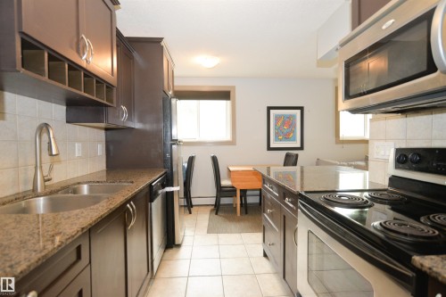 #1 10710 84 Av Nw, Edmonton, AB - Indoor Photo Showing Kitchen With Double Sink