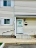 Light-toned siding exterior with white window shutters - 11430 139 Avenue Nw, Edmonton, AB 