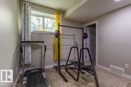 9372 Cooper Bend Sw, Edmonton, AB - Indoor Photo Showing Gym Room