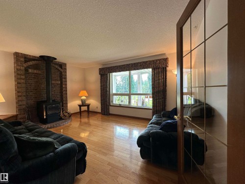 2340 28 Avenue Sw, Edmonton, AB - Indoor Photo Showing Living Room With Fireplace