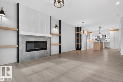 Open-concept living space featuring light wood-finish flooring - 