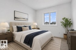 Bright bedroom featuring a large window, plush carpet flooring, and a neutral color palette - 