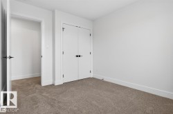 Room featuring light gray carpeting and white walls - 