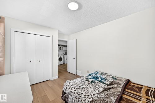 Room featuring light wood-finish flooring, white walls, and a recessed ceiling light fixture - 6208 11 Ave Nw Nw, Edmonton, AB - Indoor Photo Showing Bedroom