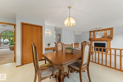 11 Heritage Boulevard, St. Albert, AB - Indoor Photo Showing Dining Room With Fireplace