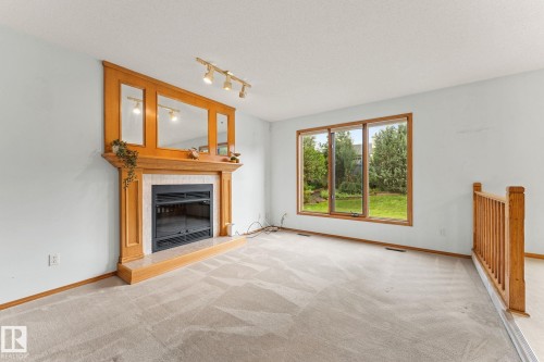 11 Heritage Boulevard, St. Albert, AB - Indoor Photo Showing Living Room With Fireplace