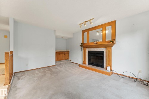 11 Heritage Boulevard, St. Albert, AB - Indoor Photo Showing Living Room With Fireplace