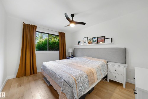 Bright interior space featuring light wood-finish flooring - 10732 129 Street Nw, Edmonton, AB - Indoor Photo Showing Bedroom