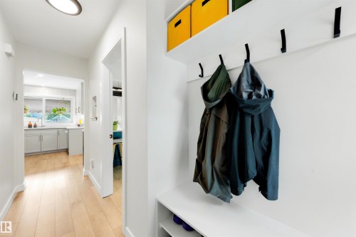Entryway featuring built-in shelving, coat hooks, and a bench - 10732 129 Street Nw, Edmonton, AB - Indoor Photo Showing Other Room