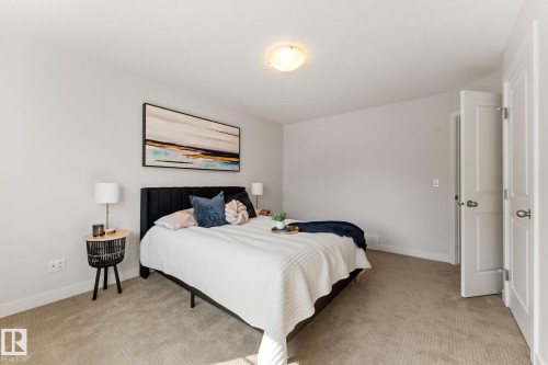 Carpeted room with light neutral wall paint - #18 7289 South Terwillegar Dr Nw, Edmonton, AB - Indoor Photo Showing Bedroom