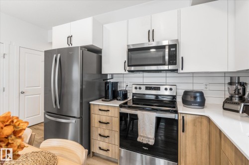 #104 860 Secord Bv Nw, Edmonton, AB - Indoor Photo Showing Kitchen With Upgraded Kitchen