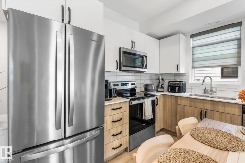#104 860 Secord Bv Nw, Edmonton, AB - Indoor Photo Showing Kitchen With Double Sink With Upgraded Kitchen