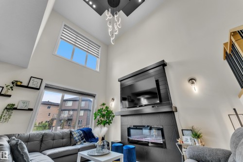 3924 41 Avenue, Beaumont, AB - Indoor Photo Showing Living Room With Fireplace