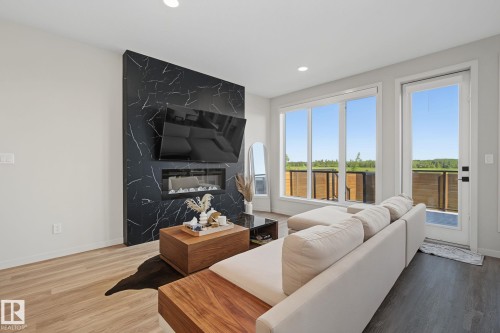 3313 Kulay Way Sw, Edmonton, AB - Indoor Photo Showing Living Room With Fireplace
