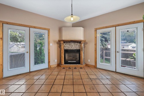11253 89 Street Nw, Edmonton, AB - Indoor Photo Showing Living Room With Fireplace