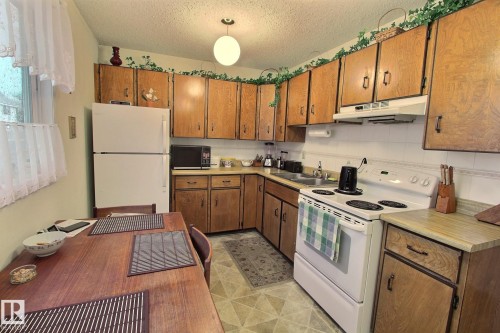 14626 52 Street Nw, Edmonton, AB - Indoor Photo Showing Kitchen With Double Sink