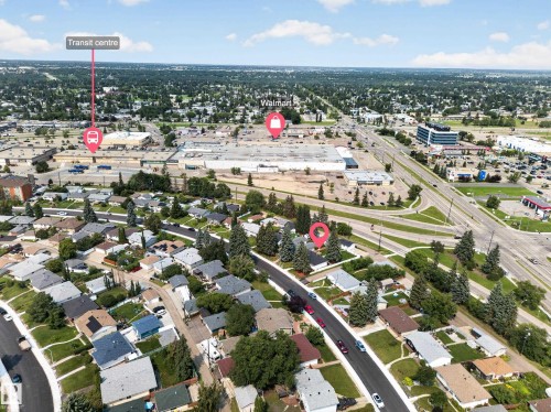 Aerial view showcasing the residential area with surrounding commercial establishments and major roadways - 5204 97A Avenue Nw, Edmonton, AB - Outdoor With View
