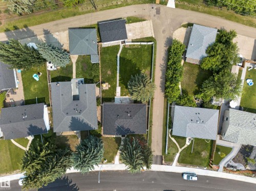 Aerial perspective of a residential street with multiple properties featuring asphalt shingle roofs - 5204 97A Avenue Nw, Edmonton, AB - Outdoor With View