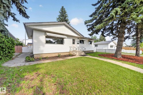 White exterior with horizontal siding and a prominent front gable - 5204 97A Avenue Nw, Edmonton, AB - Outdoor