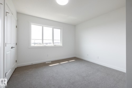 #21 7020 Keswick Cm Sw, Edmonton, AB - Indoor Photo Showing Other Room